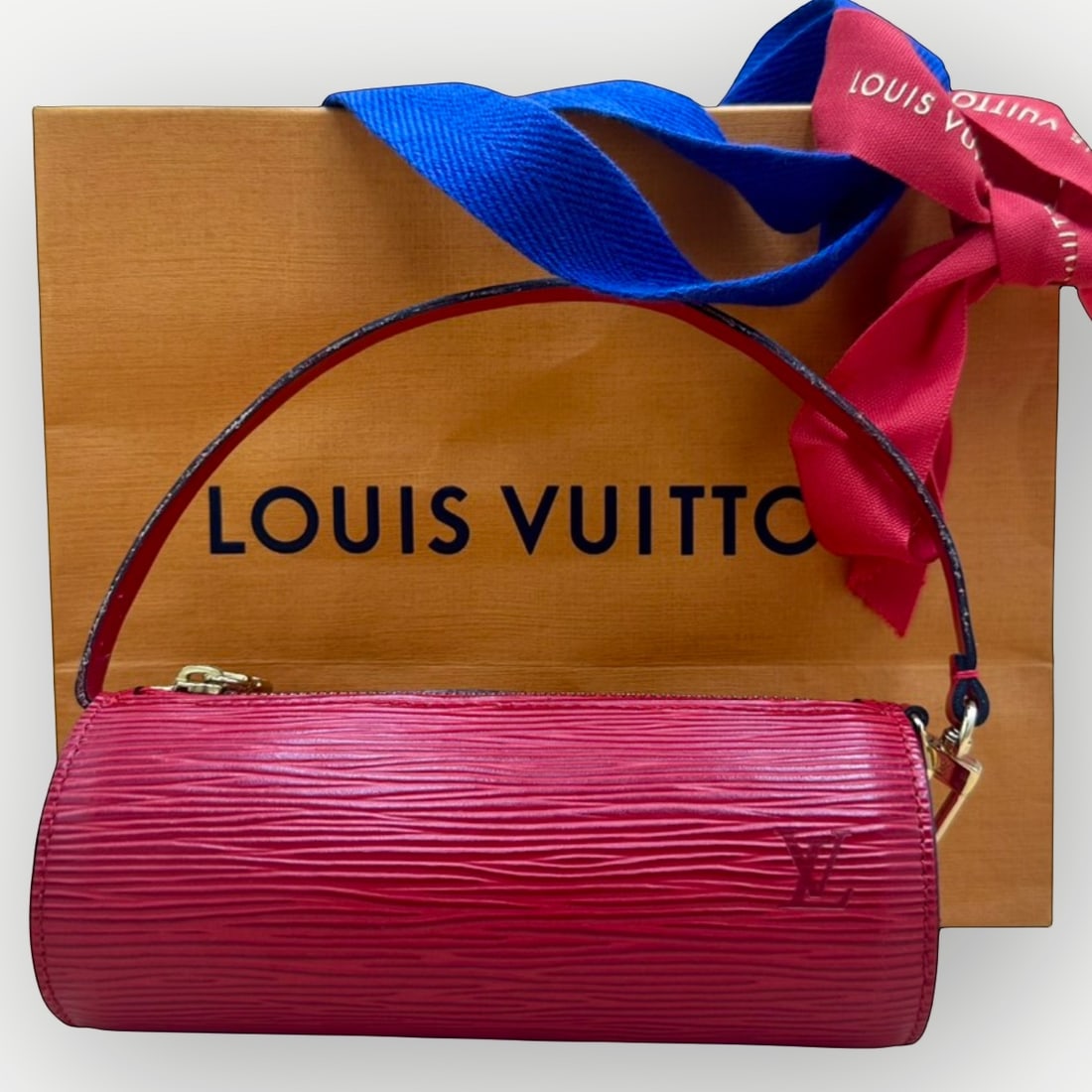 LOUIS VUITTON Papillon Pouch, Red Epi Leather, Gold-Tone Hardware: A timeless Louis Vuitton classic, this Papillon Pouch is crafted in the HouseÕs iconic red Epi leather and finished with elegant gold-tone hardware. Originally designed as the companion accessory