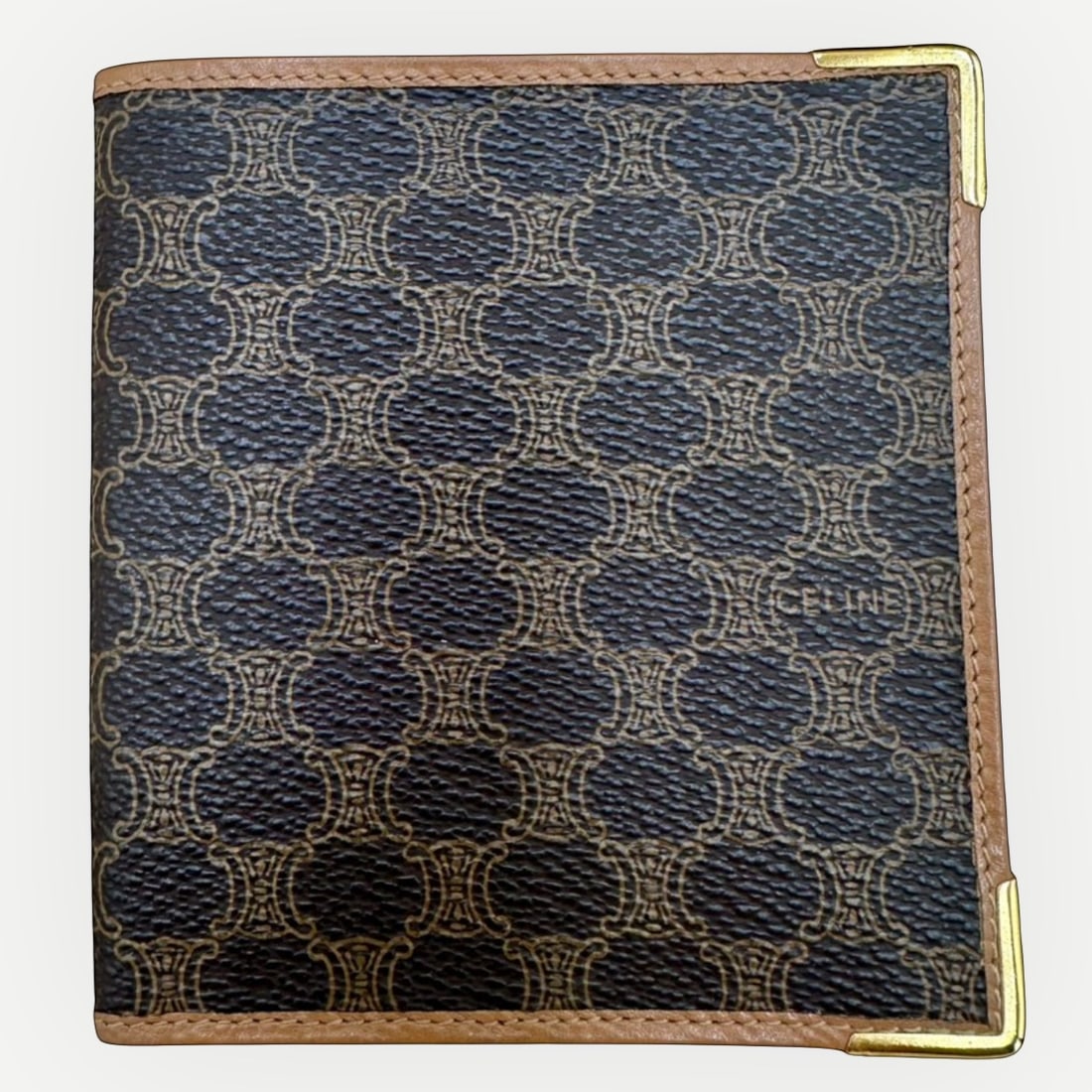 CELINE Vintage Macadam Corner Bi-Fold Wallet, Macadam Canvas & Leather: A refined example of vintage Celine craftsmanship, this Vintage Macadam Corner Bi-Fold Wallet showcases the MaisonÕs iconic Macadam canvas framed by smooth tan leather and distinguished by elegan