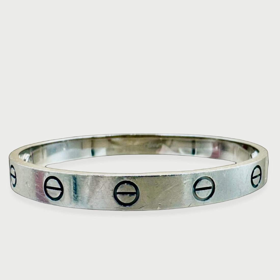 CARTIER Love Bracelet, 18K White Gold, Size 16, Classic Model: Heritage Introduced in 1969 by Aldo Cipullo for Cartier, the Love Bracelet is one of the most iconic and enduring jewelry designs in history. Conceived as a symbol of devotion so absolute it could onl
