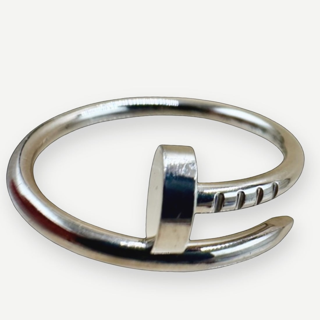 CARTIER Juste un Clou Ring, Small Model, 18K White Gold, EU Size 55 (US 7.25) Full Set: Heritage The Cartier Juste un Clou ? French for "Just a Nail" ? is one of the most subversive ideas in the history of fine jewelry. Conceived in New York in 1971, it transformed the most ordinary obje