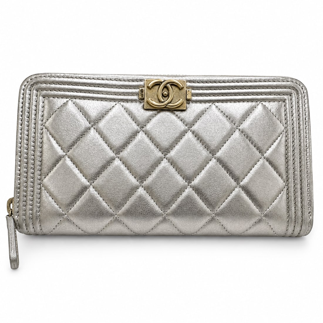 CHANEL Boy Continental Wallet, Chevron Quilted Metallic Gold Leather, Gold Hardware: Heritage The Chanel Boy collection was introduced in 2011 as Karl Lagerfeld's tribute to Gabrielle Chanel's great love, Boy Capel — a line that married the house's feminine codes with a delibera