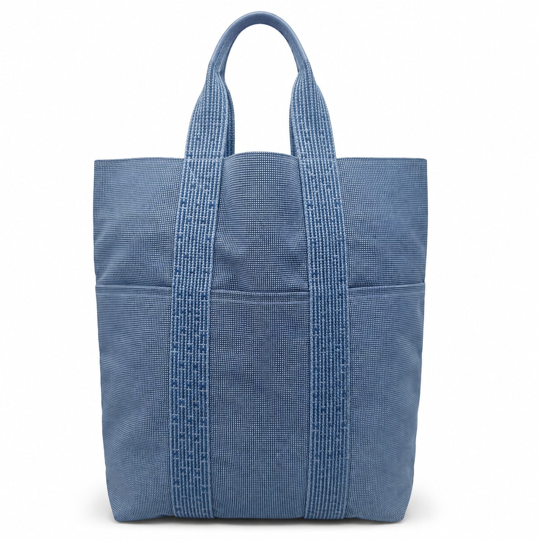 HERMES Herline Cabas MM Canvas Tote Bag: Heritage The Herms Herline Cabas MM is a study in the house's mastery of understated utility ? a structured tote born from the same atelier philosophy that produced the Birkin and Kelly, yet conceived