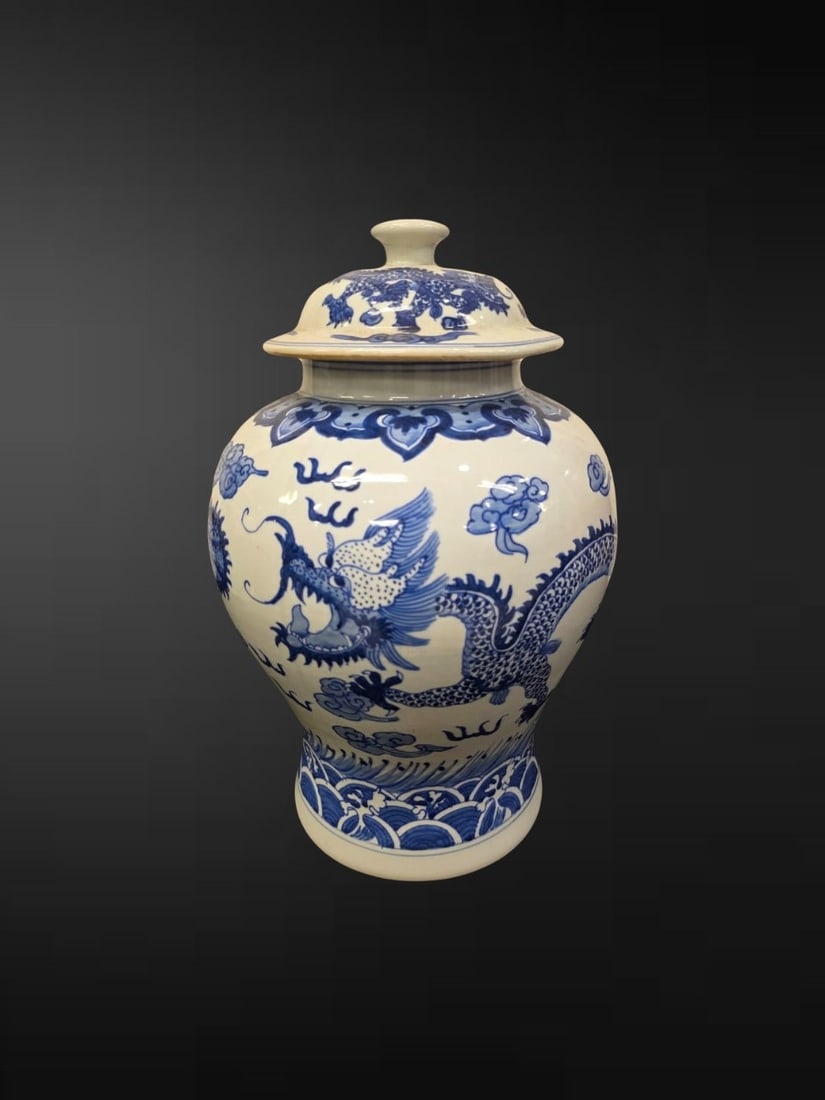 Chinese Blue and White ‘Dragon and Pearl’ Baluster Jar and Cover: A Chinese blue and white baluster jar and cover, the generously potted ovoid body painted in vivid tones of cobalt with a sinuous four-clawed dragon writhing in pursuit of the flaming pearl amid cloud