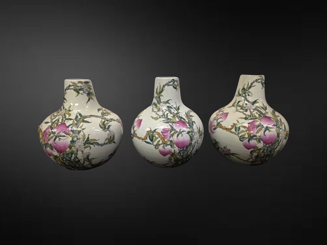 A Set of Three Chinese Famille Rose ‘Peach’ Bottle Vases (1 of 3)