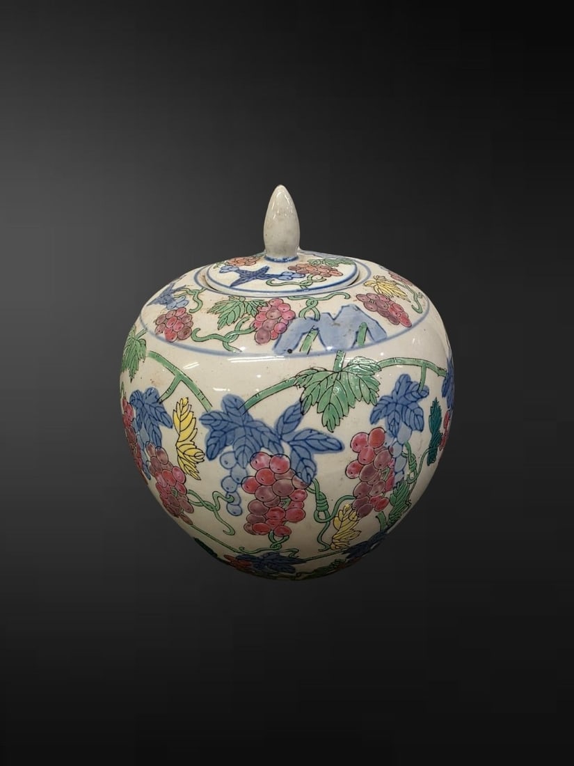 A Chinese Export Polychrome ‘Grapevine’ Ginger Jar and Cover: A charming ovoid ginger jar and shallow domed cover, decorated overall in the doucai-inspired palette with a continuous fruiting grapevine, the pendent clusters of grapes rendered in shades of rose-pi