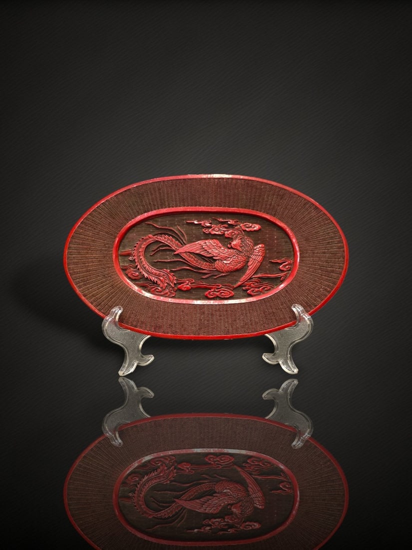 A Chinese Carved Cinnabar Lacquer 'Phoenix' Oval Dish
