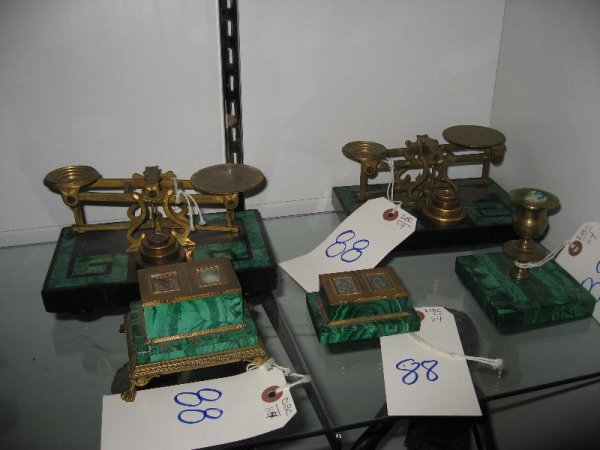A GROUP OF MALACHITE ARTICLES: INCLUDING TWO BLACK SLATE AND GILT METAL SCALES EACH MARKED LONDON, A CANDLE HOLDER AND TWO GILT METAL STAMP BOXES