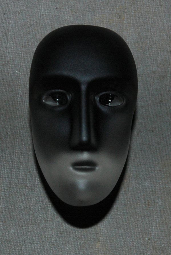 A KOSTA BODA AND VALLIEN 9986 GLASS HEAD, 1960s, len: A KOSTA BODA AND VALLIEN 9986 GLASS HEAD, 1960s, length 2". This design was created by Bertil Vallien, one of the groundbreaking figures in Swedish glass art who joined the firm of Kosta Boda in 1964.