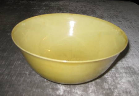 A CHINESE YELLOW-GLAZED PORCELAIN FOOTED BOWL WITH: A CHINESE YELLOW-GLAZED PORCELAIN FOOTED BOWL WITH SIX-CHARACTER MARK, (repaired crack), height 7 1/2"