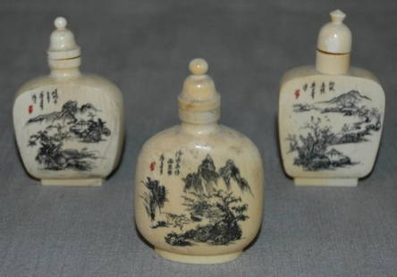 A GROUP OF THREE IVORY SNUFF BOTTLES incised with: A GROUP OF THREE IVORY SNUFF BOTTLES incised with landscape scenes and calligraphy, HEIGHT 2 1/2"