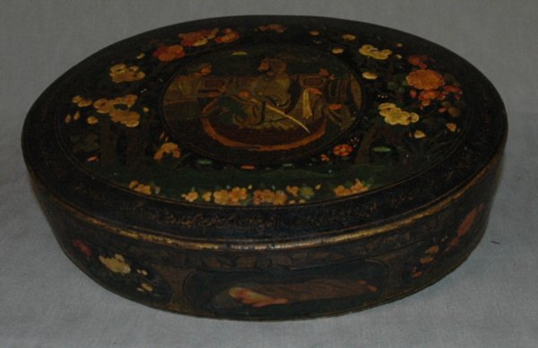 A PERSIAN OVAL PAINTED BOX, 19th Century or earlie: A PERSIAN OVAL PAINTED BOX, 19th Century or earlier, tempera on papier mache, height 3", width 13", diameter, 10".