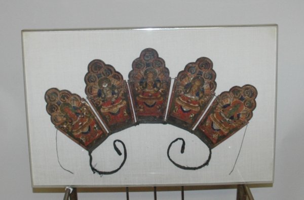 A TIBETAN PAINTED BUDDHIST MONK HEADPIECE, 19th Ce: A TIBETAN PAINTED BUDDHIST MONK HEADPIECE, 19th Century, incorporating five lobe arched panels with representations of the Buddha, length 23", width 15 1/2" framed