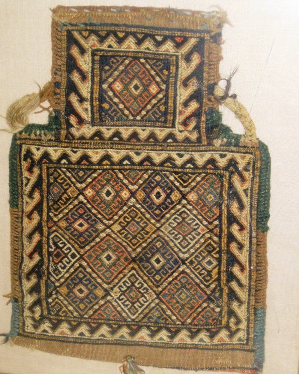 A PERSIAN SOUMAC SALT BAG, 19" X 13" framed: A PERSIAN SOUMAC SALT BAG, 19" X 13" framed