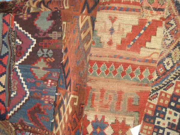 A LARGE GROUP OF KILIM FRAGMENTS including a 19th: A LARGE GROUP OF KILIM FRAGMENTS including a 19th century Balkan carpet fragment, 4' 10"