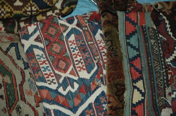 A GROUP OF RUG FRAGMENTS: A GROUP OF RUG FRAGMENTS