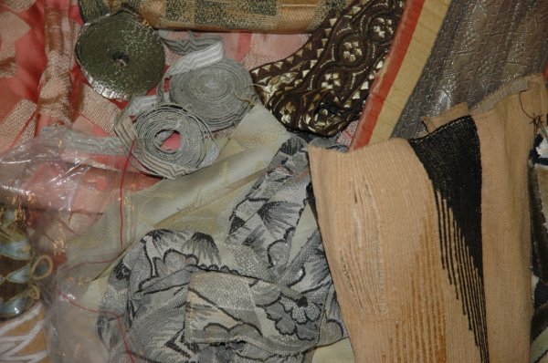 A GROUP OF PASSEMENTERIE TRIMMINGS, mostly art de: A GROUP OF PASSEMENTERIE TRIMMINGS, mostly art deco and later, various types of ribbon, large fragments, including some metal braid.