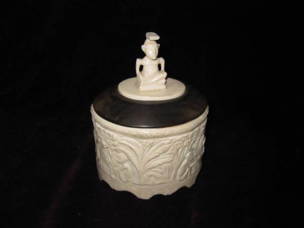 AFRICAN CARVED IVORY TUSK BOX, WITH EBONY MOUNTS: AFRICAN CARVED IVORY TUSK BOX, WITH EBONY MOUNTS