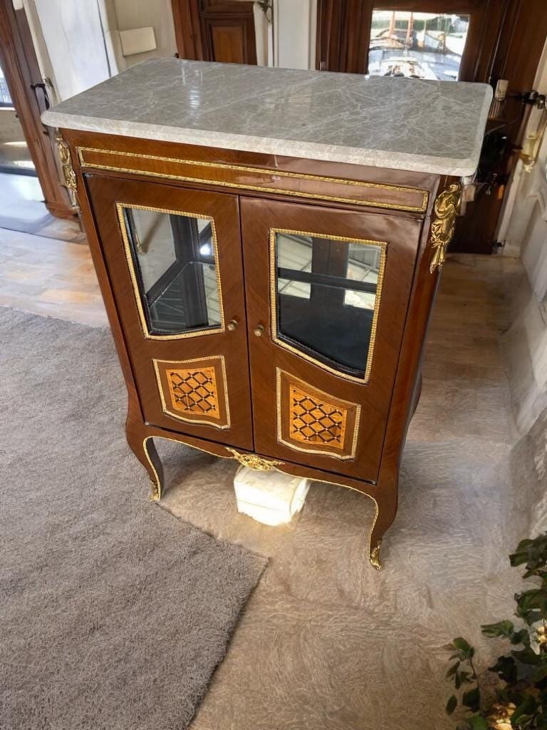 French Louis XV Style Marble Top Cabinet: Elevate your interior with this exquisite Antique French Louis XV Style Cabinet, a truly timeless piece blending refinement and functionality. This stunning cabinet showcases the sophistication of cla