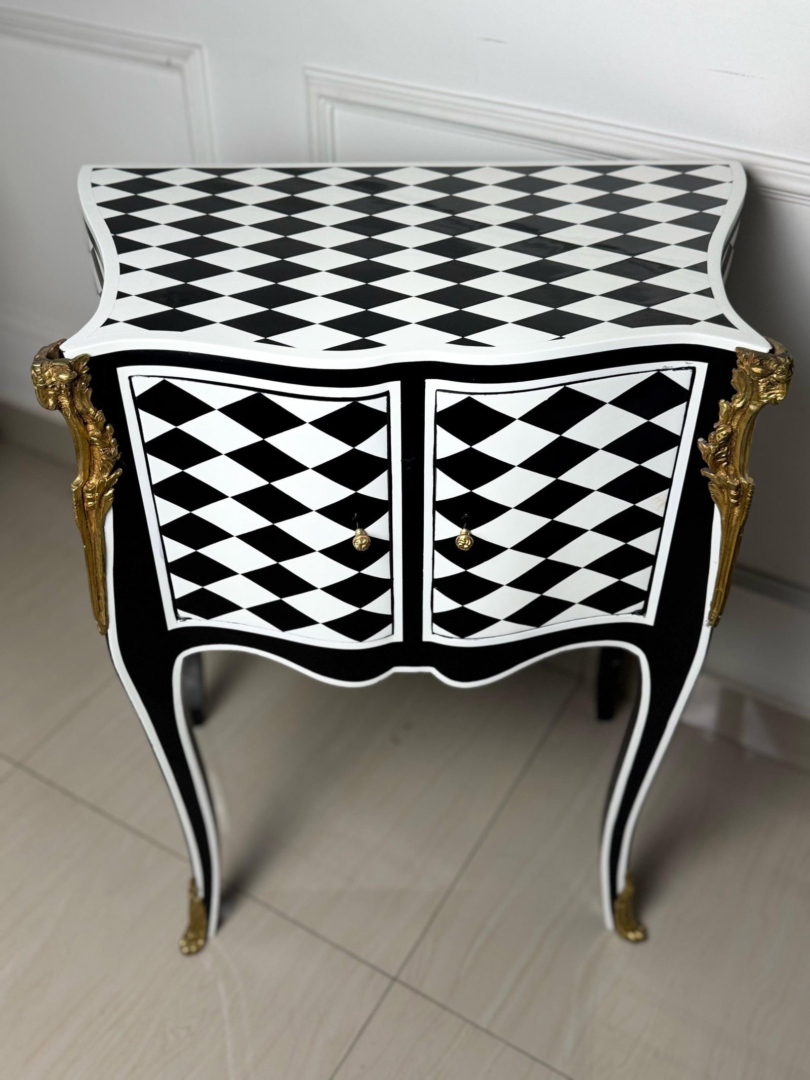Unique Louis XV Courtly Checkered Side Table: A Louis XV courtly checkered table with storage in a black, white, and gold color scheme would be a luxurious and opulent addition to your decor. This style often features intricate detailing and grac