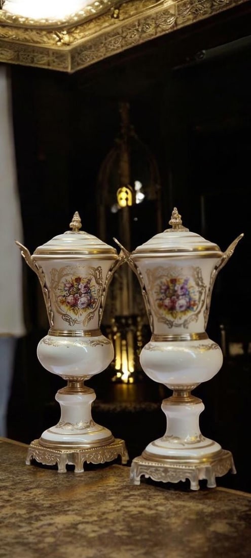 French Porcelain Urn Set | Hand-Painted Rococo: Add a majestic statement to your home decor with this stunning 3-piece French-style porcelain urn and centerpiece set. Showcasing opulent hand-painted artistry and intricate gilded bronze detailing, t