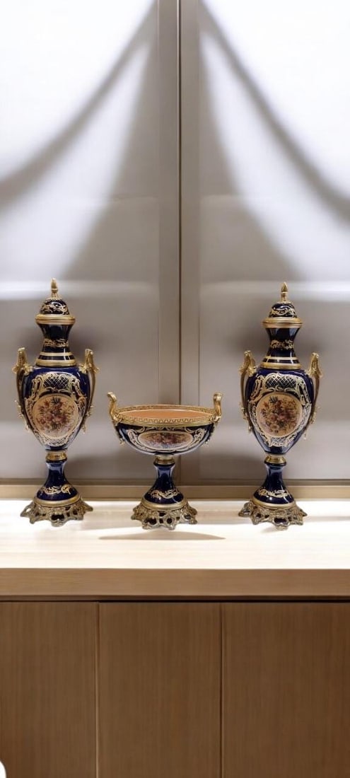French Porcelain Urn Centerpiece Set: Elevate your home decor with this luxurious 3-piece French-style porcelain urn and centerpiece set. Designed to evoke the grandeur of 18th-century European palaces, this set is a perfect statement pie