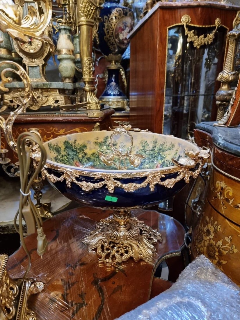 French Porcelain Centerpiece Bowl – Cobalt Blue: Description: An opulent French porcelain centerpiece bowl, designed in the Rococo revival style. This striking decorative piece features a deep cobalt blue exterior adorned with ornate gilt bronze (or