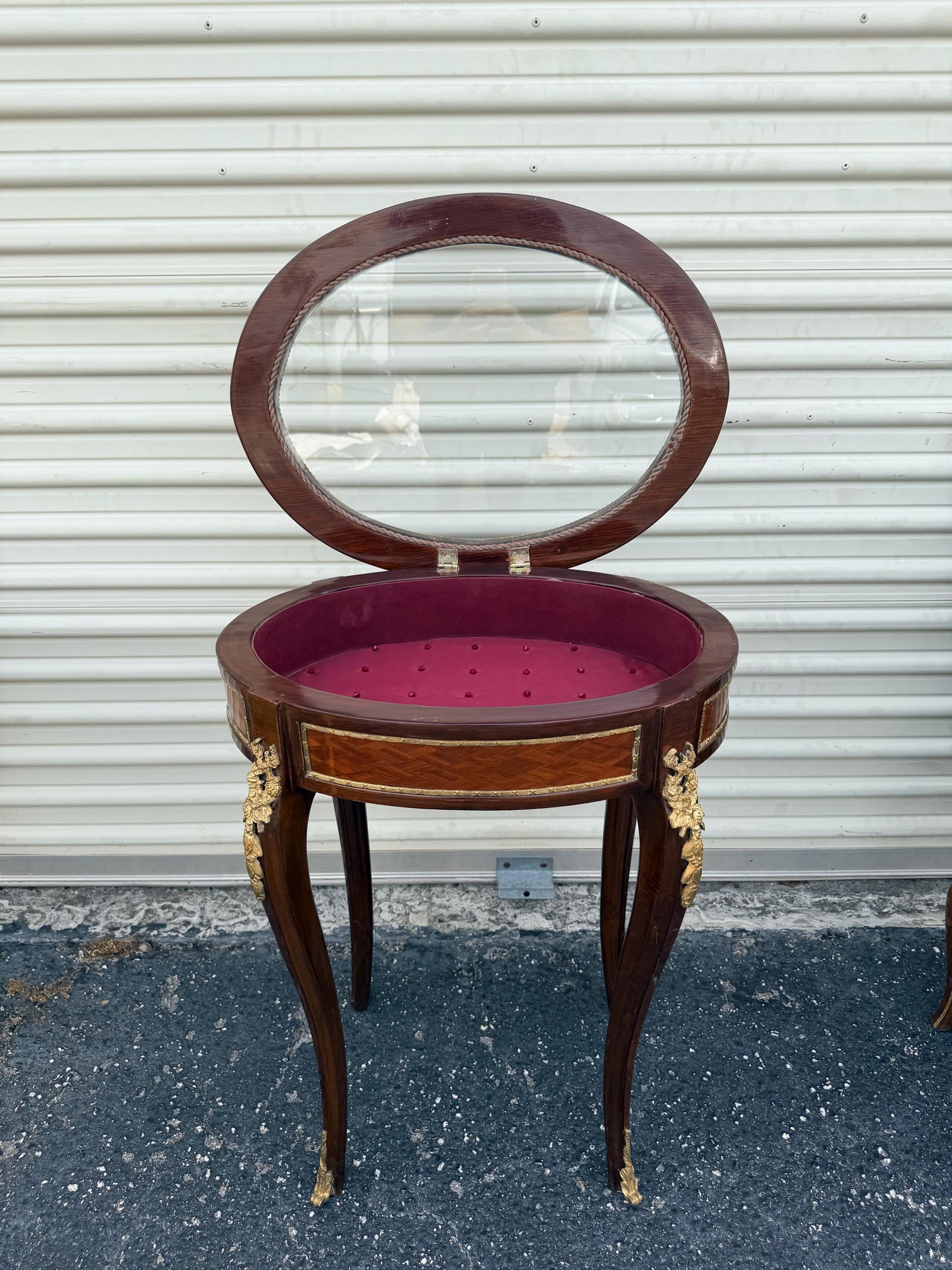 Louis XV Style Mahogany Showcase French Rococo: Add a refined touch of French elegance to your space with this exquisite Louis XV-style side table, masterfully crafted with intricate details and a glass showcase top. This piece is ideal for display