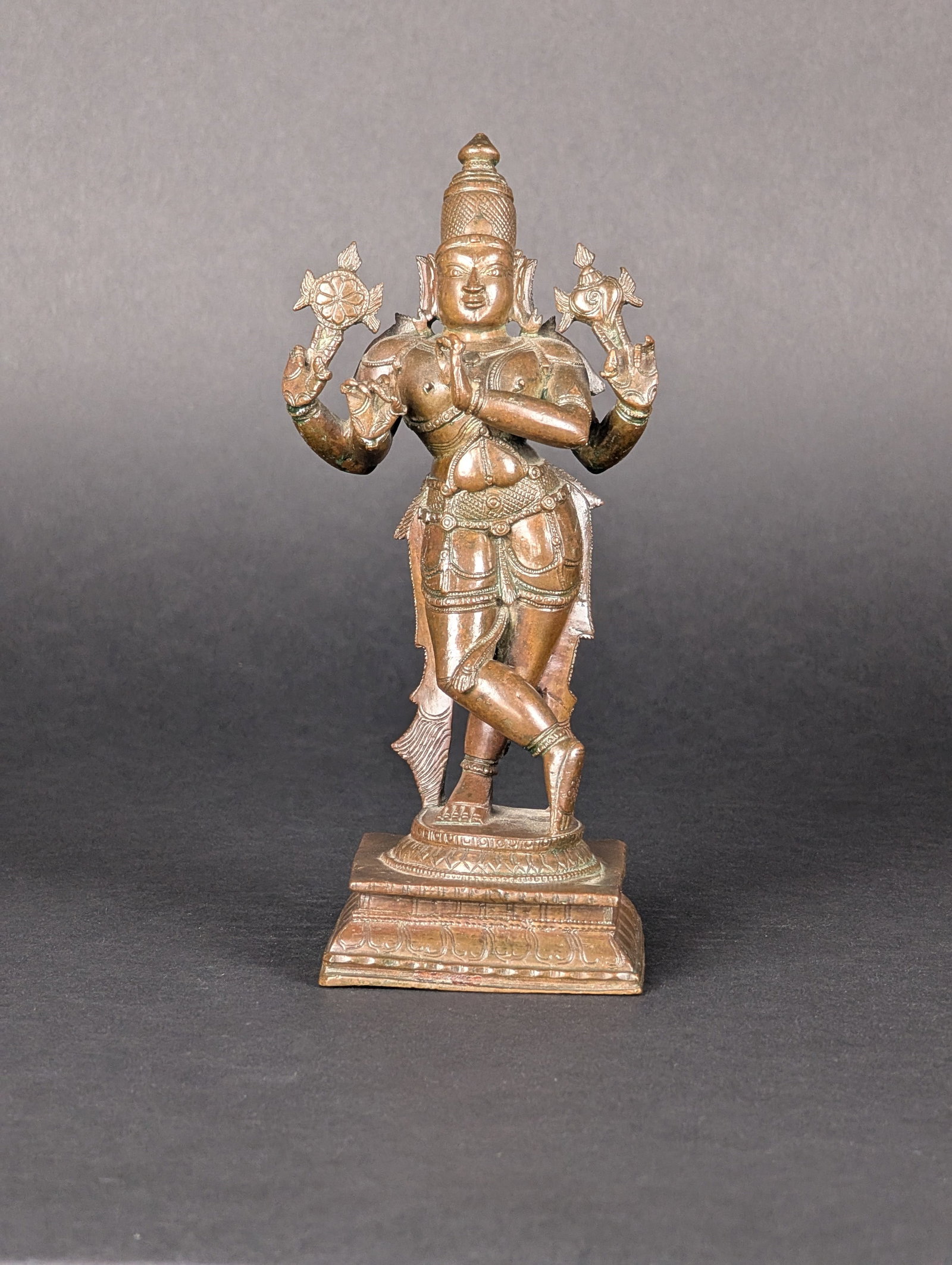 Venugopal: Krishna, in the form of Venugopal--a four armed manifestation of Krishna playing the flute. In the upper arms, Venugopal holds the instruments of Vishnu, a conch and the wheel. His lower two arms hold