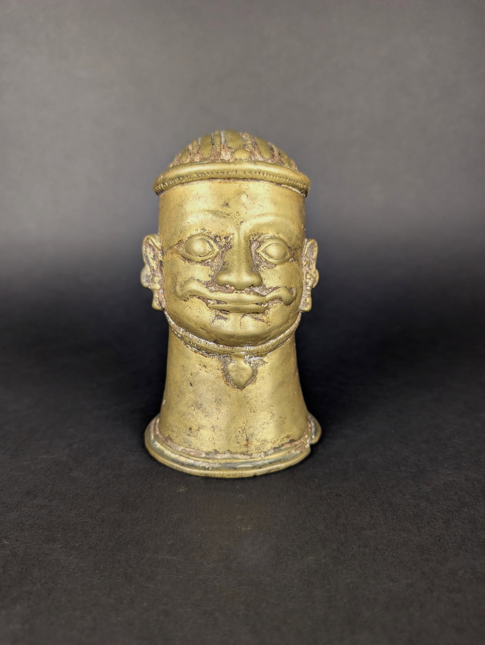 Large Shiva Mukhilinga: An impressive-sized Mukhalingam at 6 inches in height. This aniconic form is used to cover the Shiva Linga, generally in stone. The moustache and turban on this casting are lovely. Estimated Age: 18th