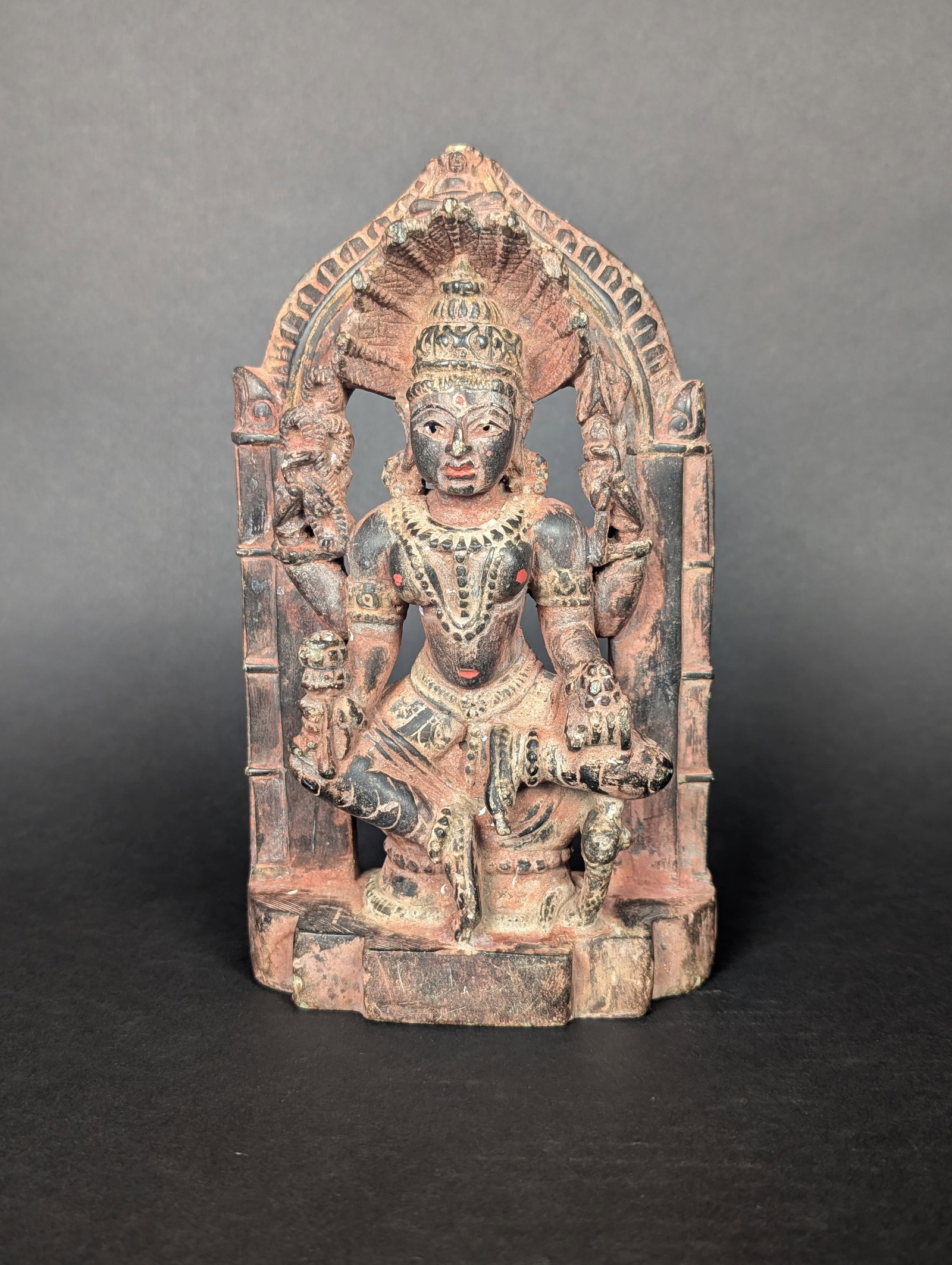 Padmavati Devi, Sasana Devi of Parsvanatha the 23rd Jain tirtankara: Padmavati Devi is the most worshipped Jain Yakshi. She is depicted here in stone with a small image of her Beloved Lord Parsvanatha above her head. Padmavati sits on her lotus throne holding in her up