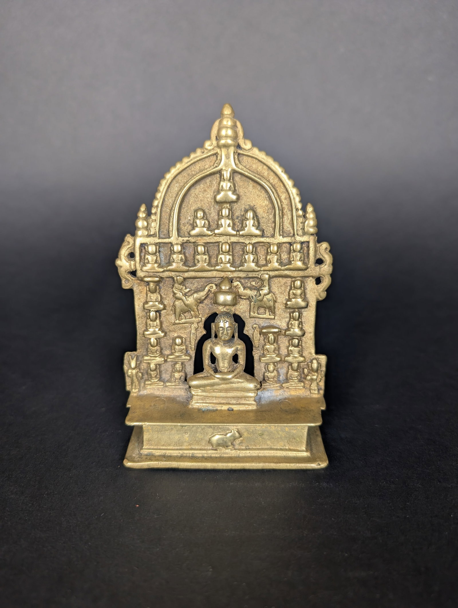 Jain Chaubisi Altar with 24 Tirthankaras, North-West India. 18-19th c.: This altarpiece is packed with symbology. It is believed that the insignia to identify the Tirthankara is a Bull, which would make the central Jina, Adinath, the 1st Tirthankara. It is further believe