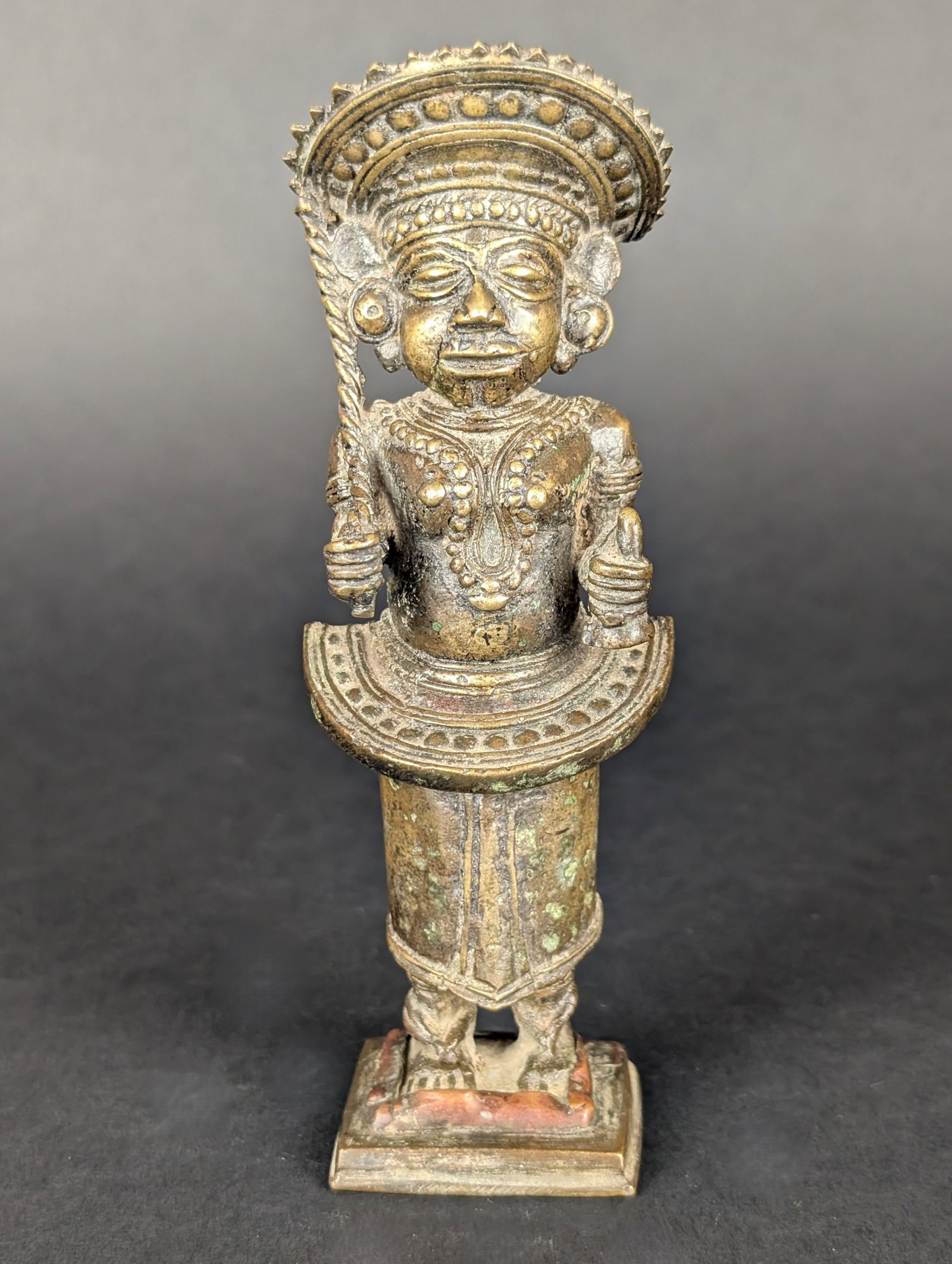 Bhuta Priestess: This priestess is an Oracle-sayer and is a part of Bhuta worship from the South West Coast of India. Well crafted. Note the twisted blade of the sword resting against her right shoulder, her bell, the