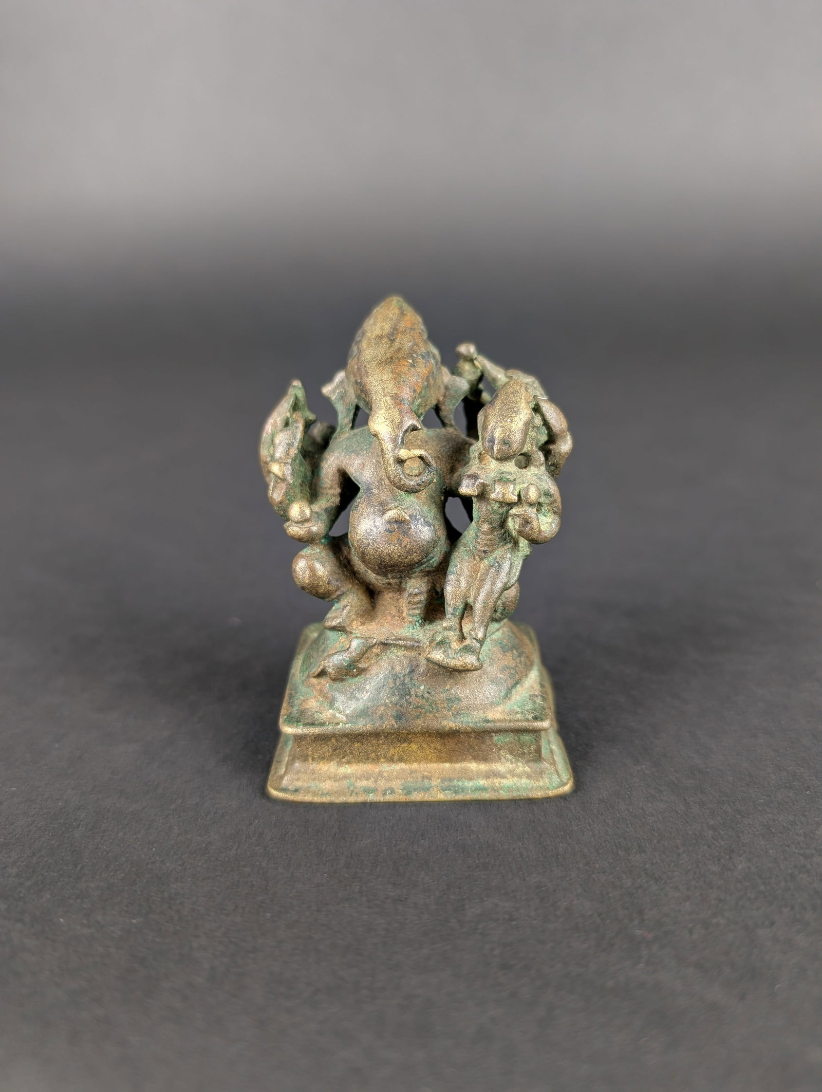 Mahaganapathi: Ten-armed Ganesha with Sakthi is called Mahaganapathi. It is a rare iconography. Ganesha is worshipped as the remover of obstacles. Estimated age is 18th century. Dimensions: 2.75" H x 2" W x 1.125"
