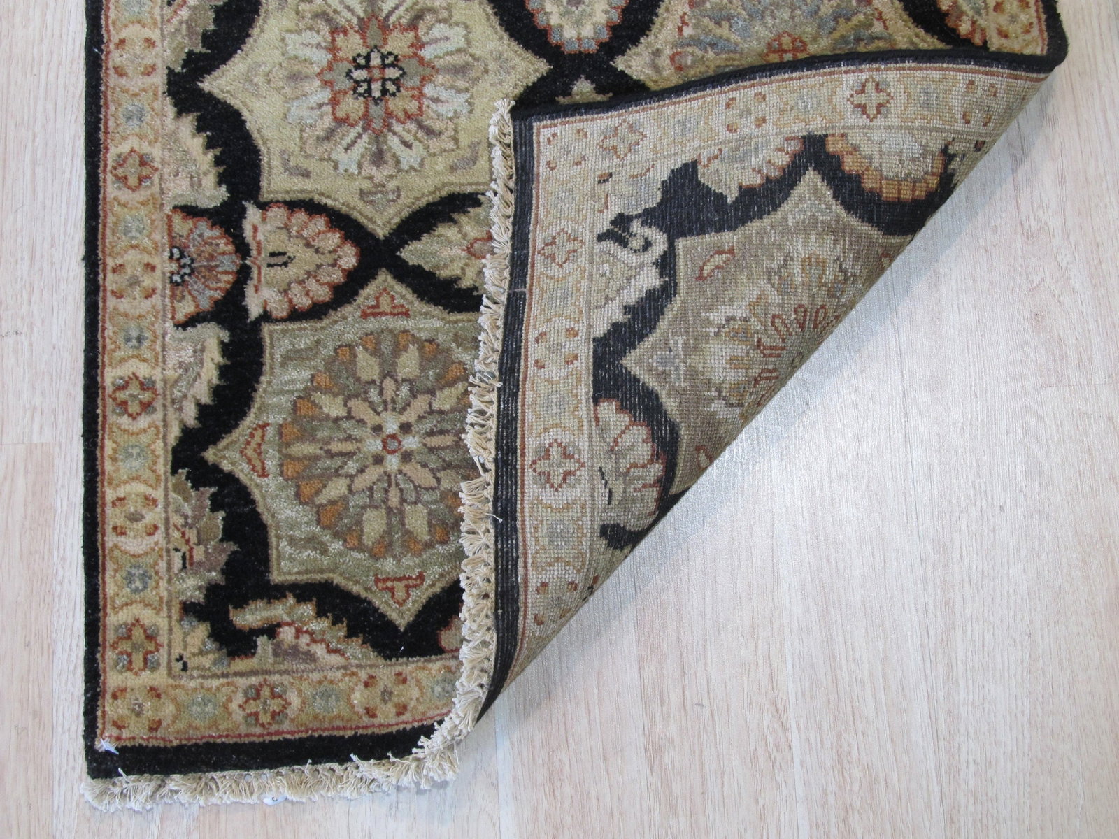 Agra Hand-Knotted Wool Runner Rug 2'6 x 11'8, Black: Agra runner rug, hand-knotted in wool, in black tones, brand new, approximately 2'6 x 11'8 (30 x 140 inches, 0.5-inch pile), a long 12 ft hallway runner. The Timeless Agra in Black is hand knotted at 