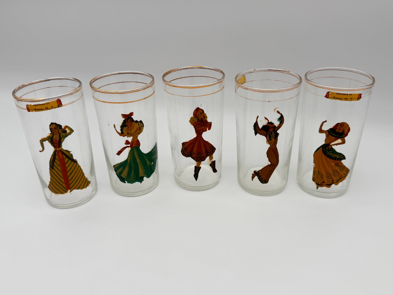 Vintage Rome NY Souvenir Glasses 18+: Set of 5 souvenir tumblers with pin-up dancer decals. Vintage, decal wear present.