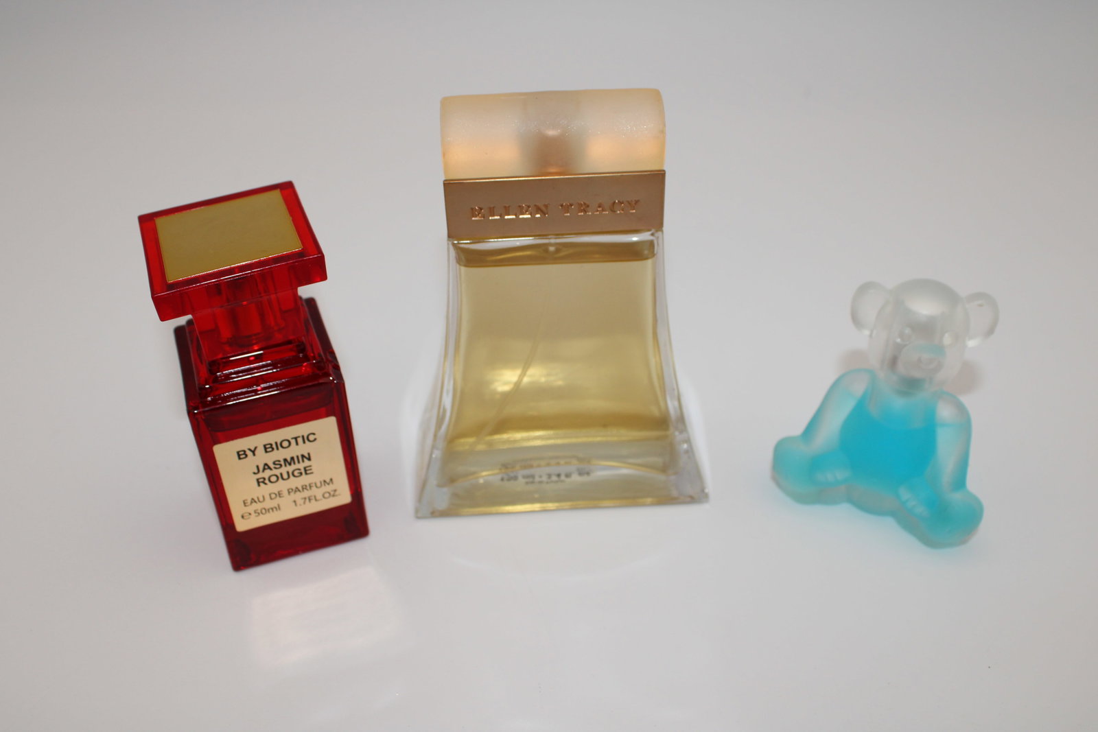 Lot of 3 perfumes - Ellen Tracy / Jasmin Rouge / Bear Shape: See photos for amounts left in bottles.