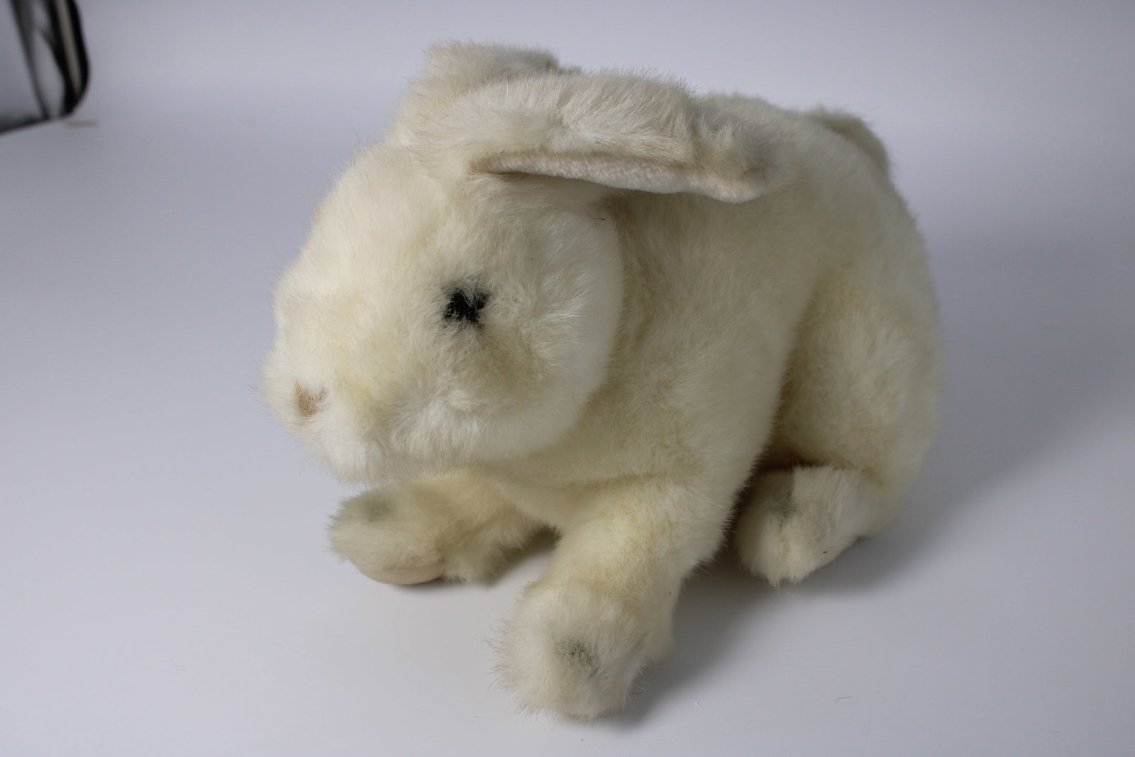 Vintage White Plush Rabbit: Soft white plush rabbit with floppy ears, black eyes, brown nose, and original manufacturer tag dated 1987