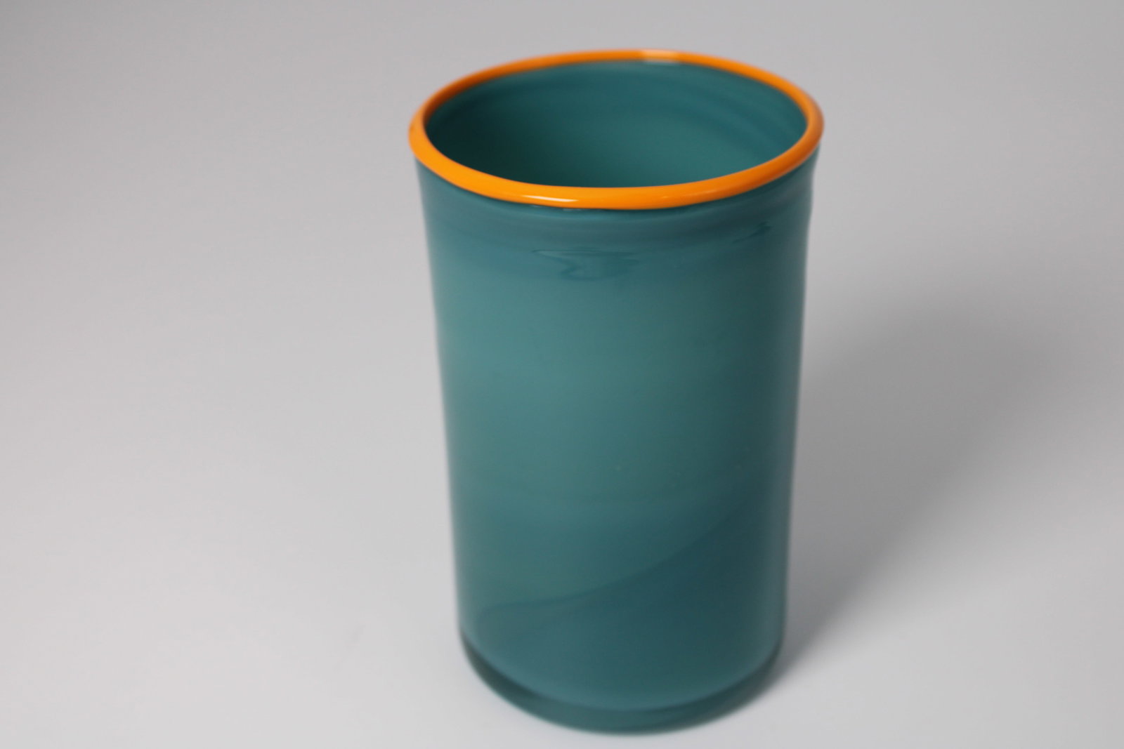Teal Art Glass Vase, Orange Rim: Opaque teal art glass cylinder vase with bright orange rim. 6" tall x 3.65" diameter
