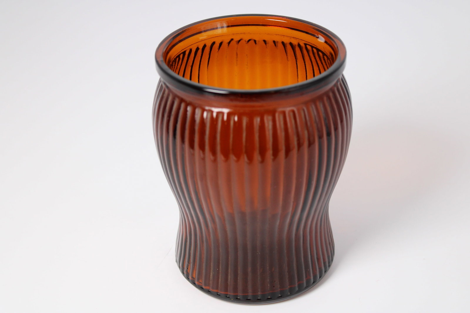 Vintage Amber Pressed Glass Vase: Vintage amber ribbed glass vase. 5" x 3.75"