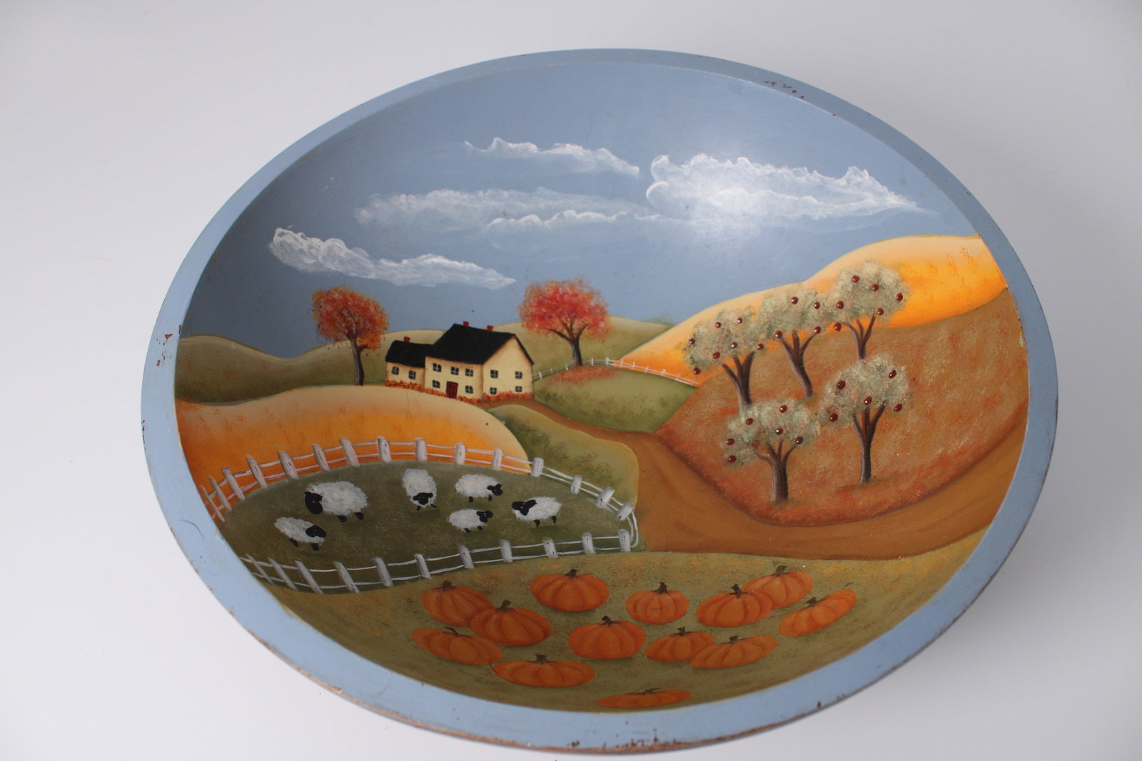 Meiwa Japan Painted Wooden Farm Scene Bowl: Hand-painted pastoral design with farmhouse, sheep, pumpkins and trees; measures 12.75" diameter x 4.5" tall; rim scuffs and paint loss