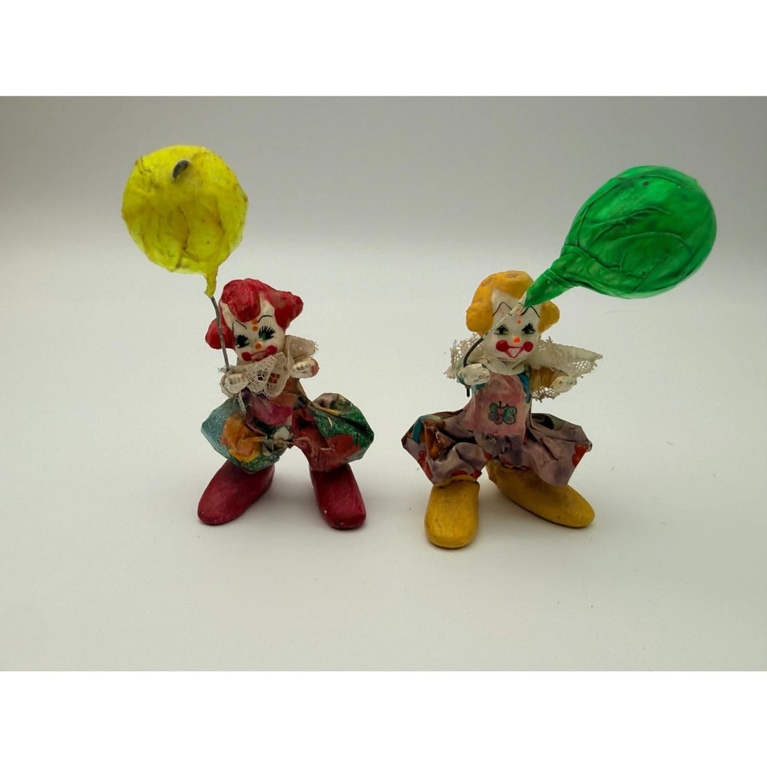 Vintage Papier Mâché Clown Figurines Balloon Pair Folk Art: Each measures approximately 4-4.5 inches tall. A whimsical folk art display piece with plenty of vintage character.