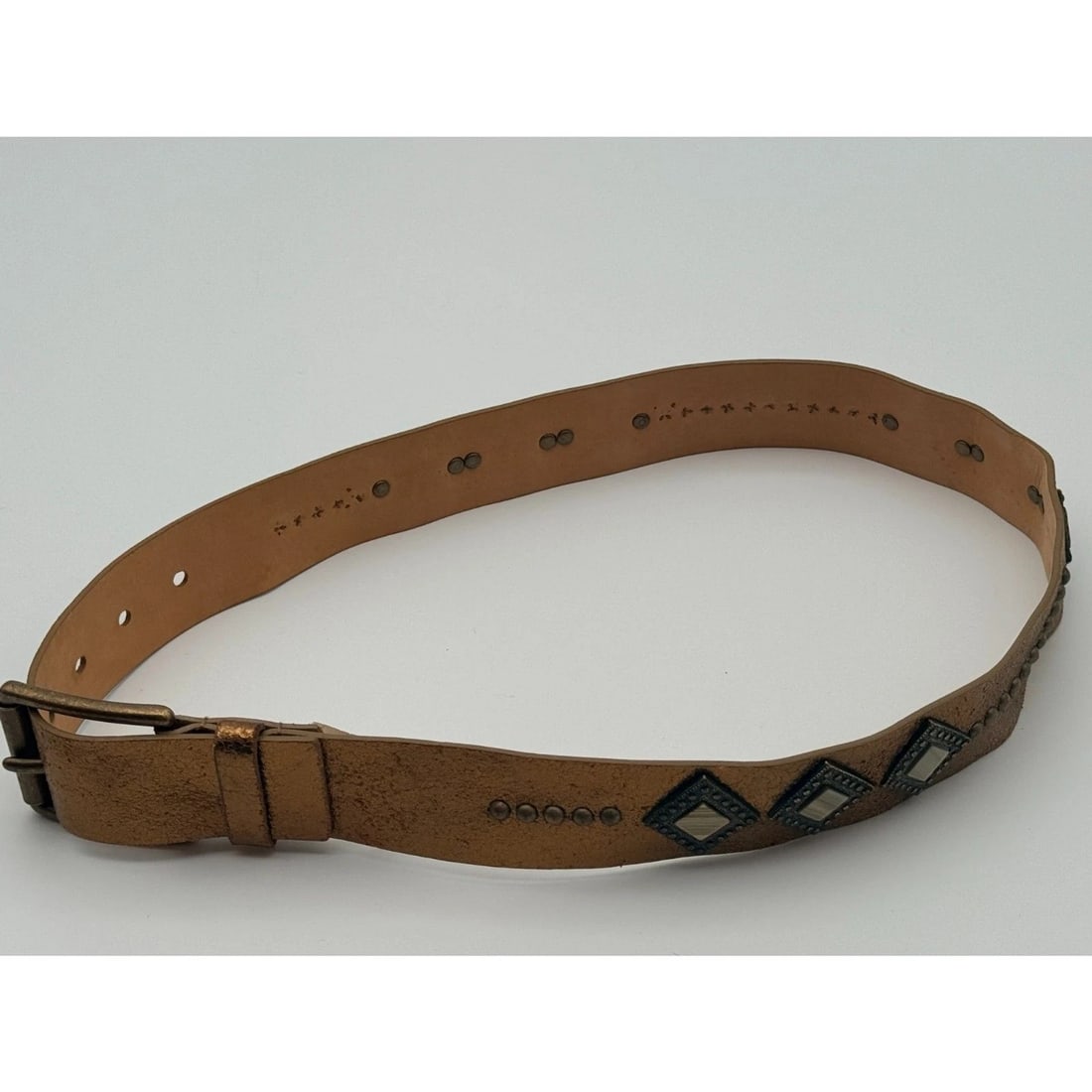 Another Line Bronze Italian Leather Belt Size S: Bronze leather belt with square mirror accents, metal studs and antiqued buckle; style 23707. Marked Italian leather; visible wear