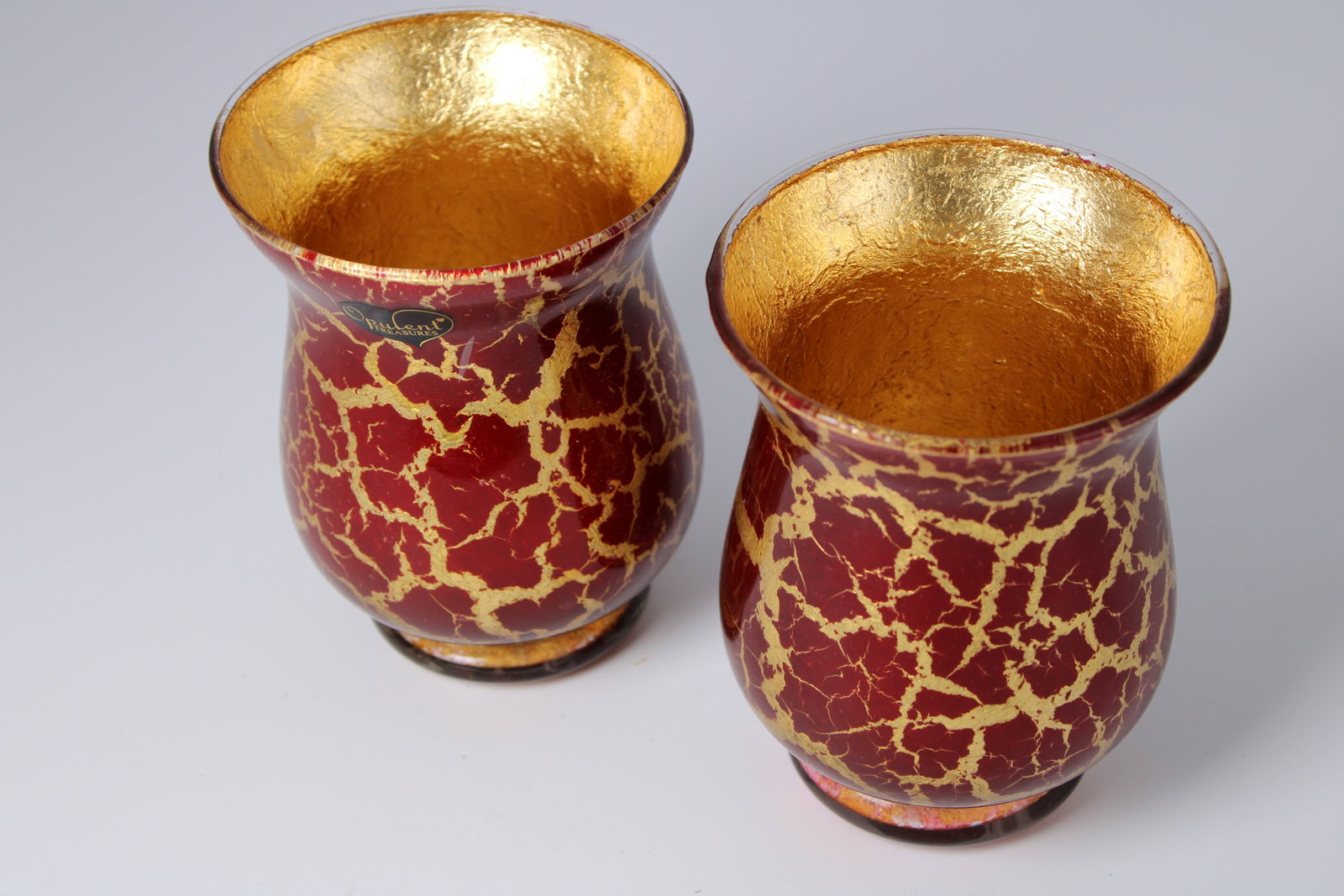 Pair of Opulent Treasures Red Gold Vases: Pair of red decorative vases with gold crackle finish and gold interiors. Each measures 5.5 inches tall by 4.25 inches in diameter