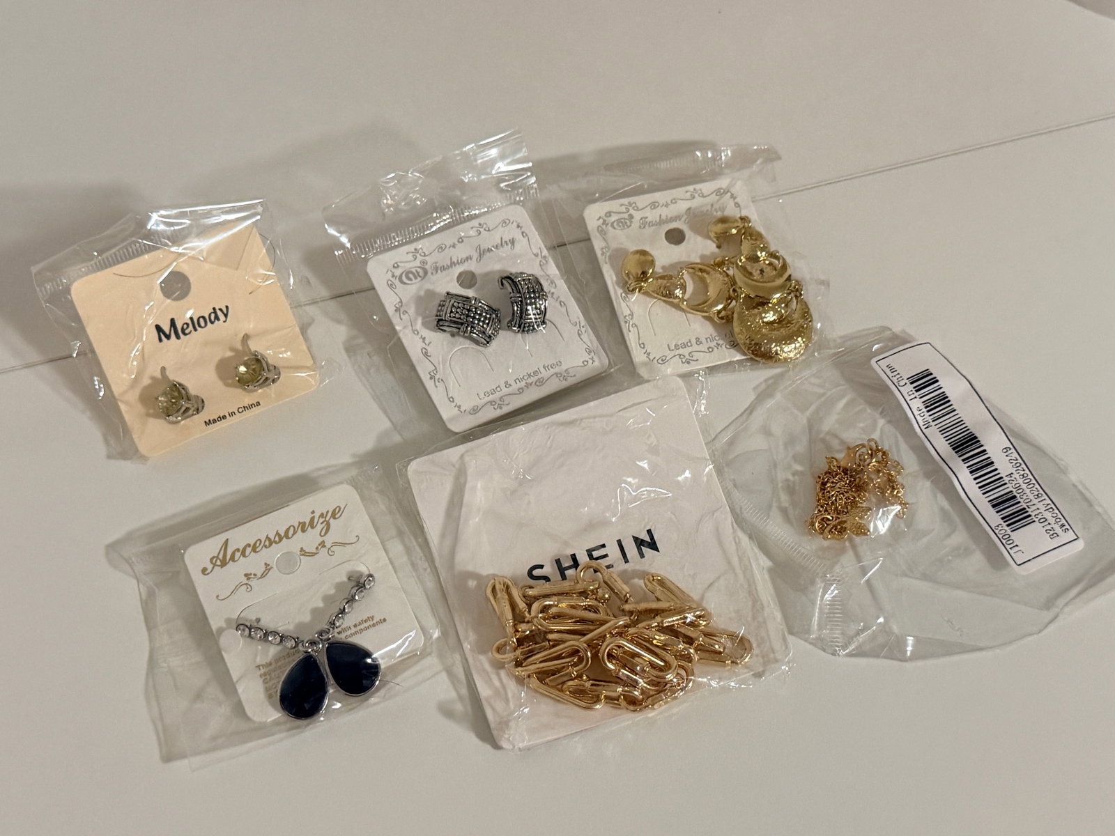 Fashion Jewelry Lot: Earrings necklaces & chains