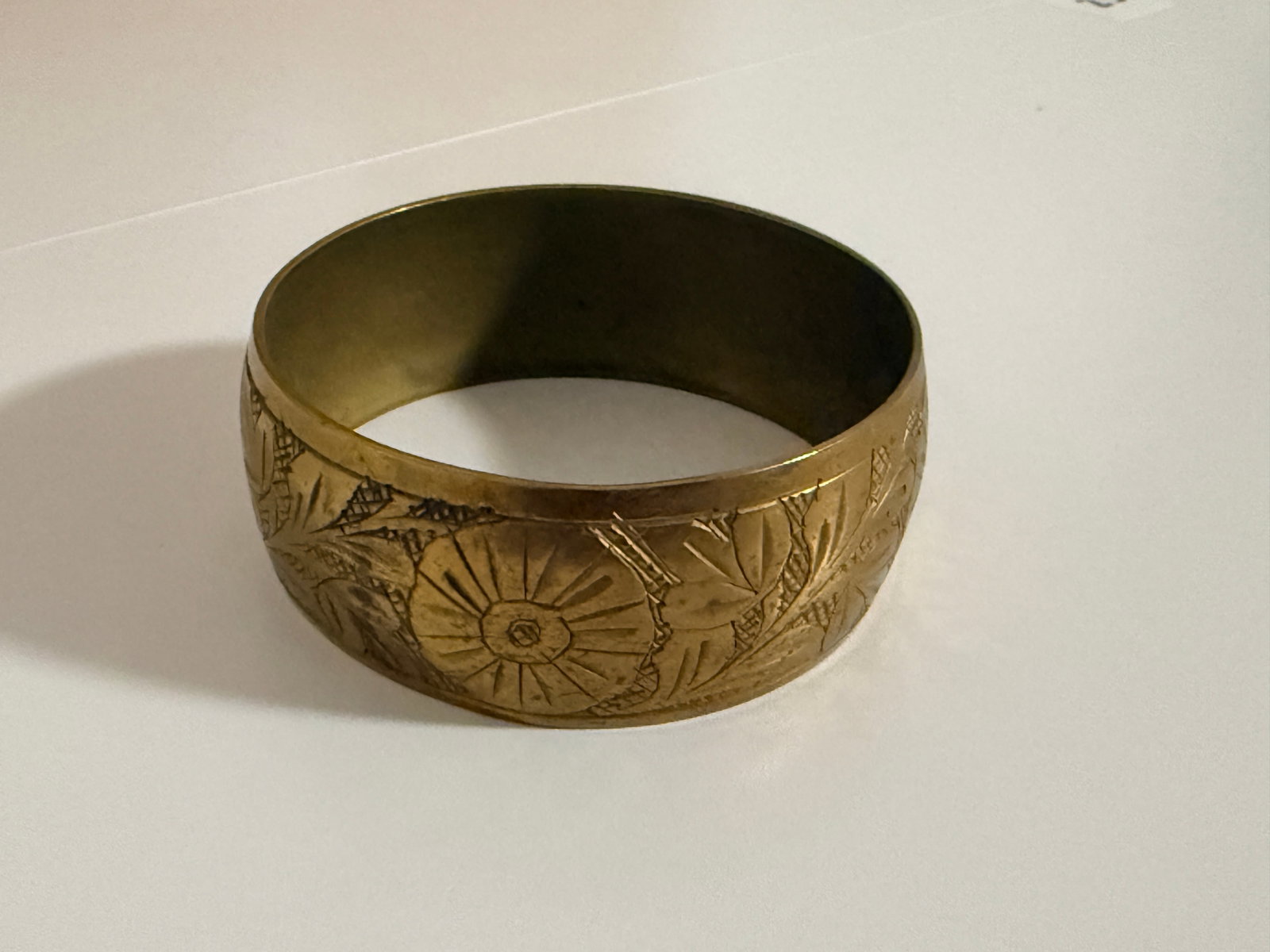 Etched Brass Bangle: Wide floral etched brass bangle
