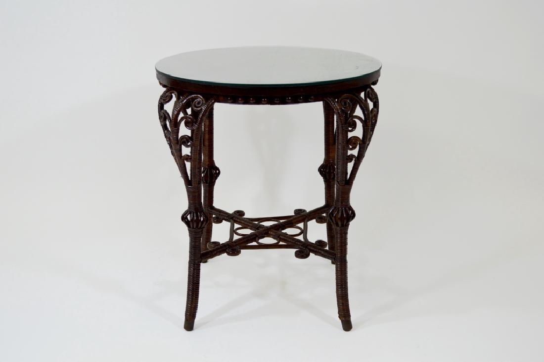 Wicker Drink Table with Glass Top: 21 1/2" diameter top, 25" tall. Scrollwork base, very good condition