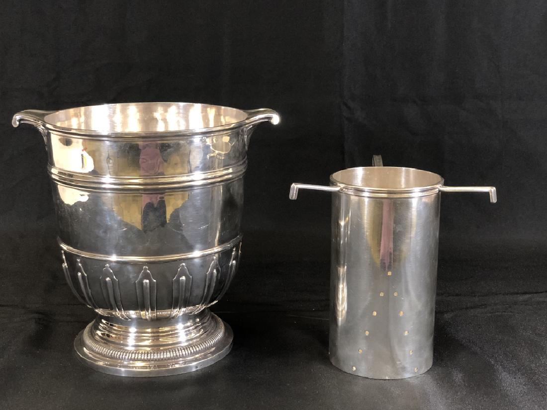 Silver Wine Cooler - 9" tall: double handle with removable insert. some minor dents around perimeter, very small silver touch marks.This lot is from the Beltran-Kropp Estate from San Francisco, California. Peruvian Ambassador Pedr