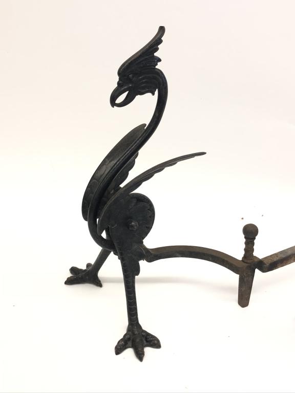 Pair of Phoenix Andirons: made of iron. 20 1/2 inches tall and 2 feet deep. In good condition. Originally from a home in Lake Placid, NY.
