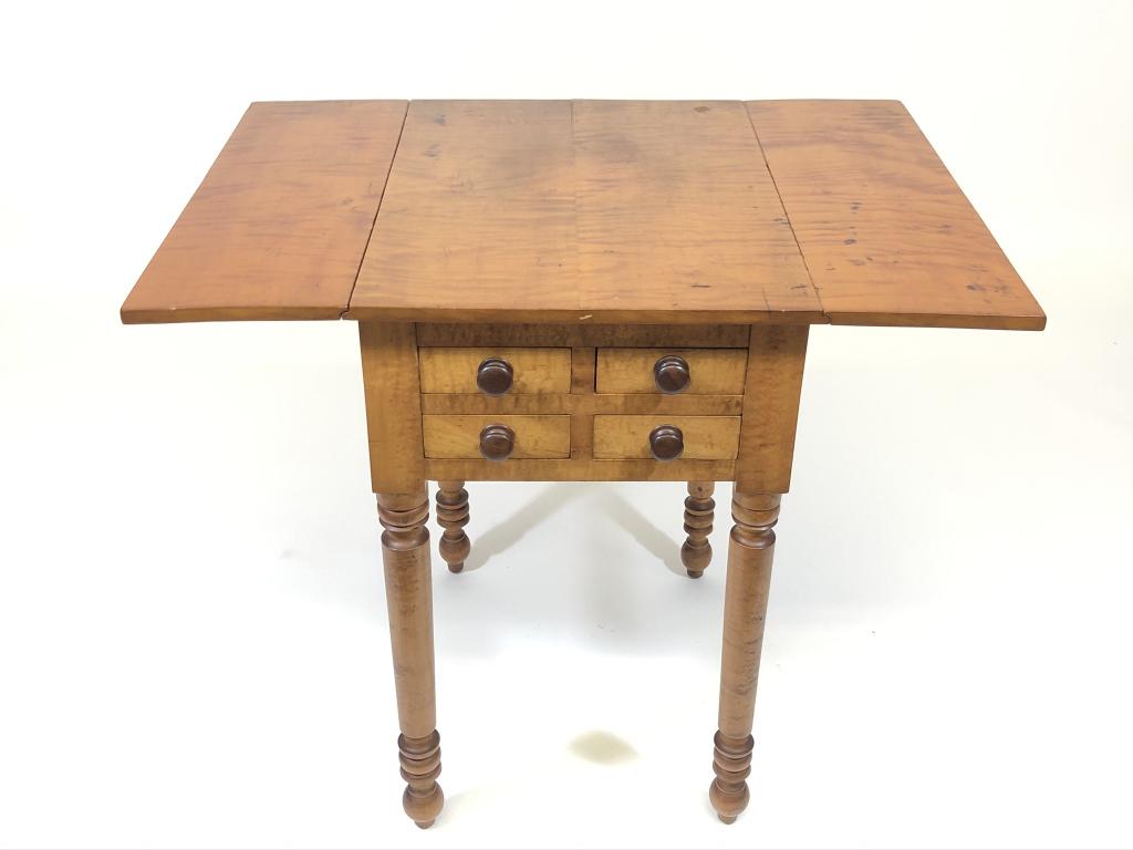 Highly Figured Curly Maple Drop Leaf End Stand: unusual form, drawers in both sides, front has 4 small drawers and there is one larger drawer on back. Mid 1800's. 28 inches tall x 22 inches x 17 inch top with leaves down. 7 1/2 inch leaves. Sherato