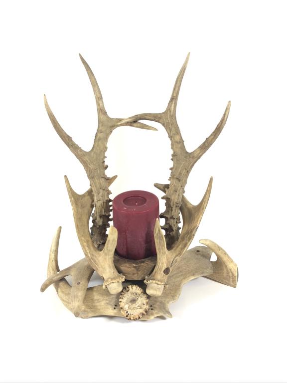 German Black Forest Antler Candle Holder: 12 inches tall and 11 inches wide. Has a full body carved stag medallion on front.